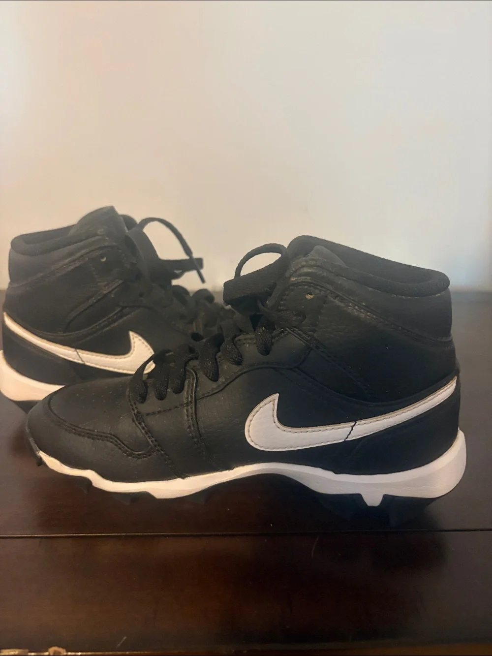 Jordan 1 Mid Cleats. Kids' Black and White High-Top.